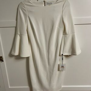 White bell sleeve Calvin Klein dress.